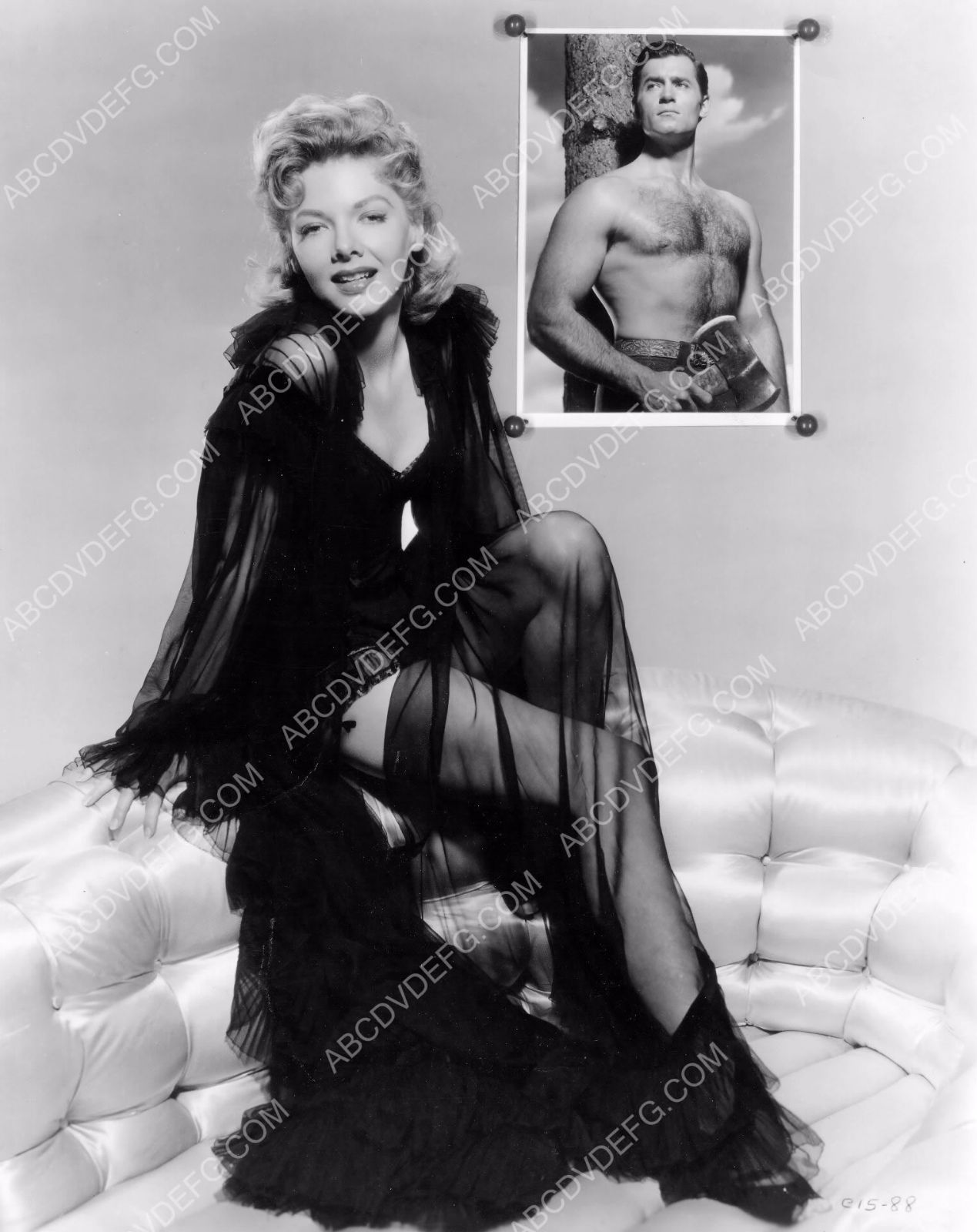 Barbara Lawrence black lingerie pinup has barechested Clint Walker for